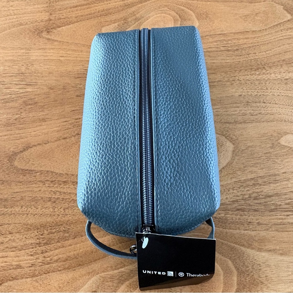 New, sealed Therabody toiletry kit